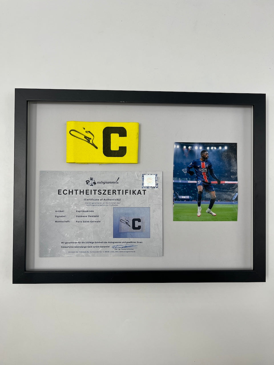 Captain's armband signed by Ousmane Dembele in a PSG COA frame