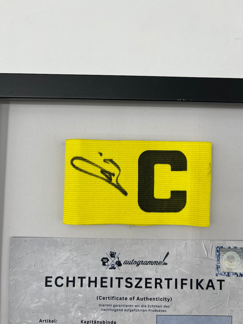 Captain's armband signed by Ousmane Dembele in a PSG COA frame