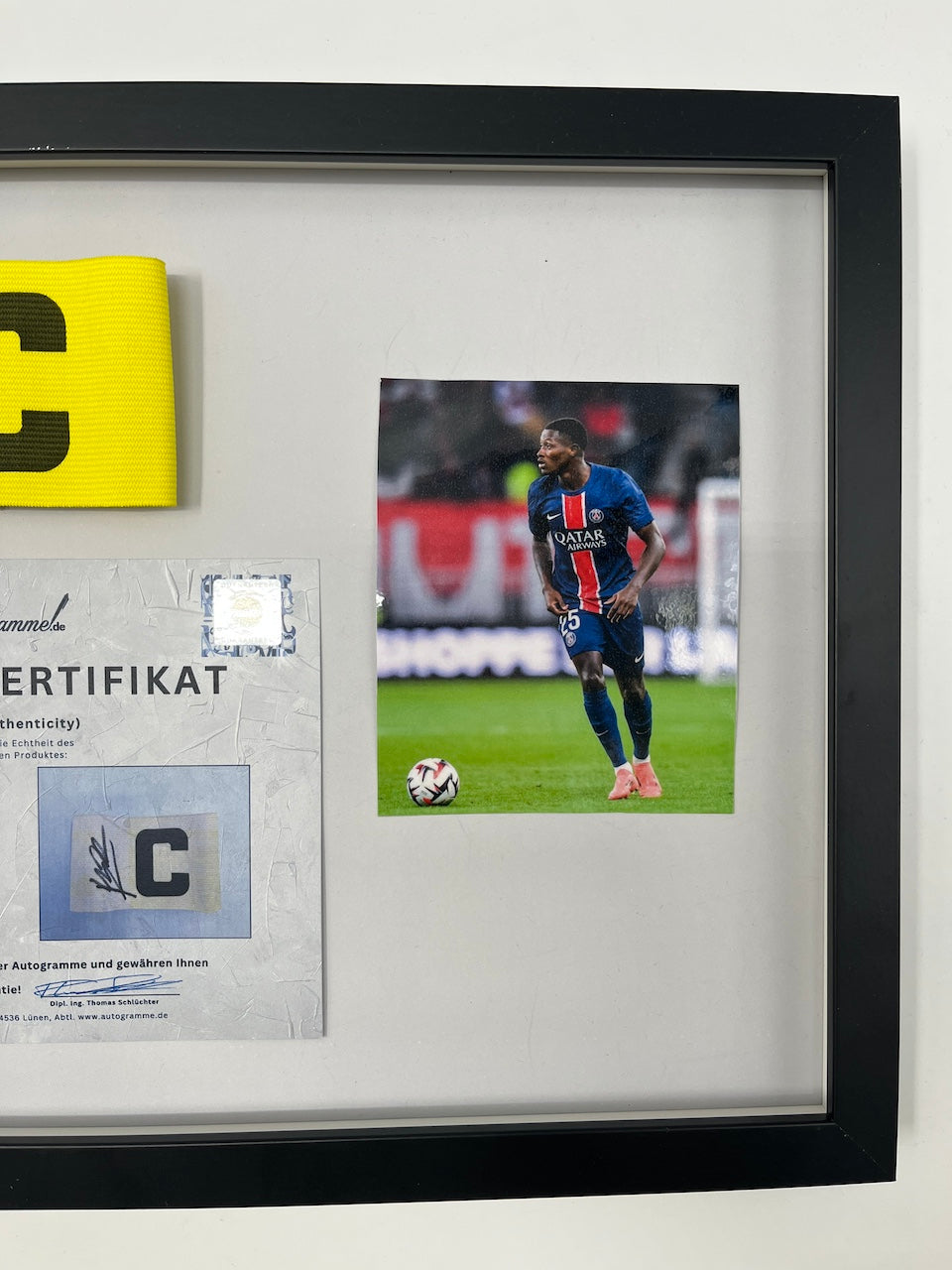 Captain's armband signed by Nuno Mendes in the PSG COA frame