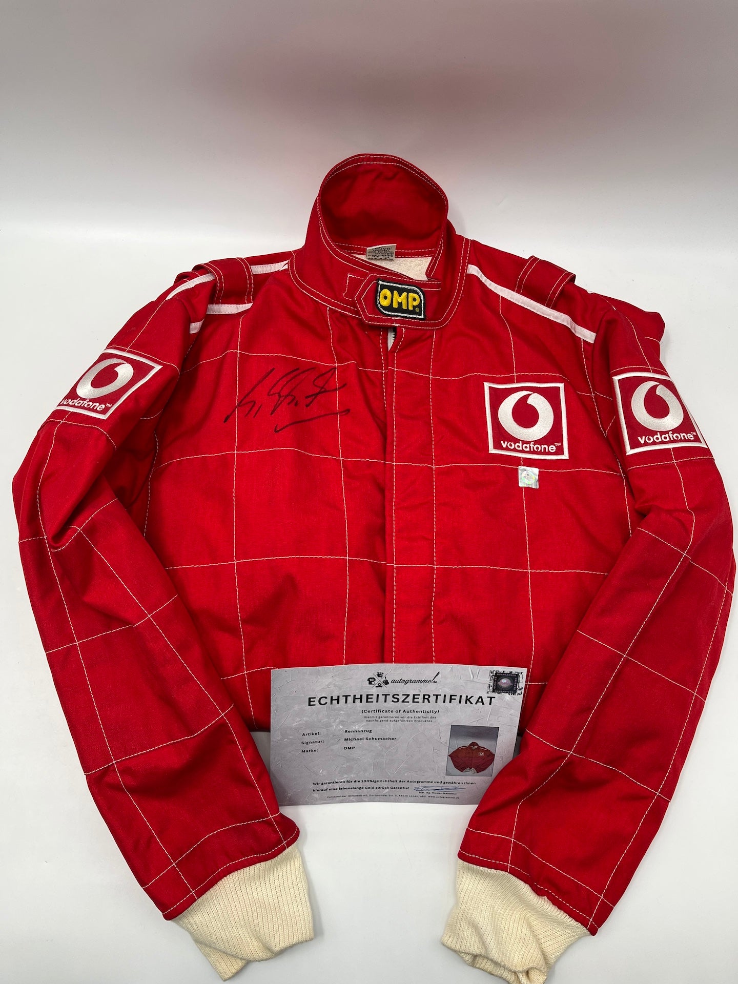 OMP Rennanzug signiert von Michael Schumacher Autogramm