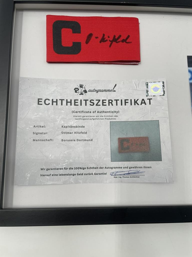Captain's armband signed by Ottmar Hitzfeld in a Borussia Dortmund autograph COA frame