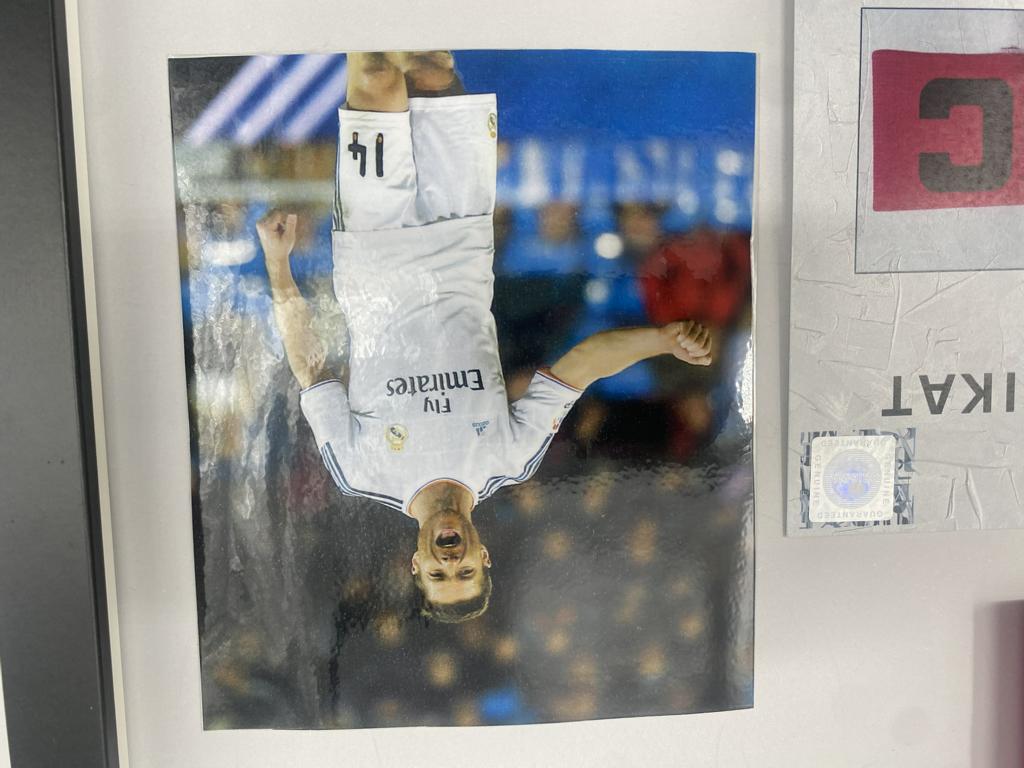 Captain's armband signed by Xabi Alonso in a Real Madrid football COA autograph frame