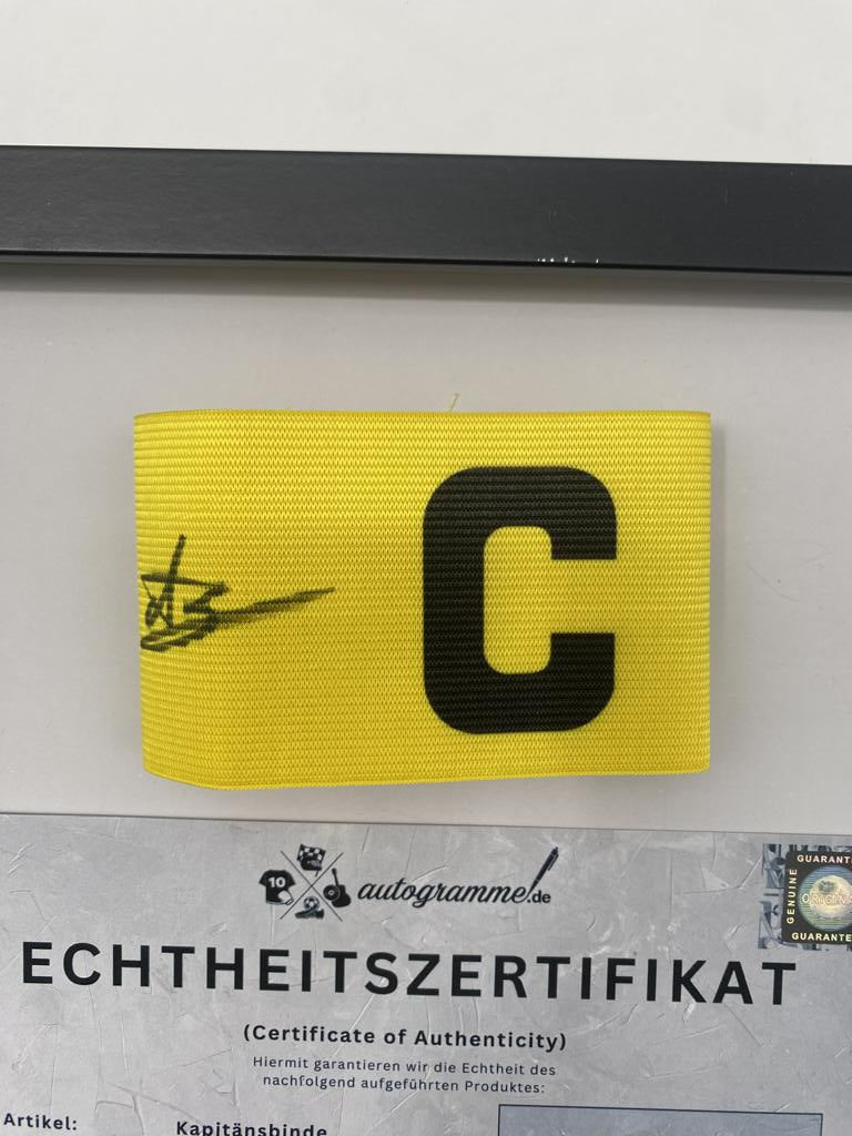 Captain's armband signed by Wolfgang "Teddy" de Beer in a Borussia Dortmund COA frame