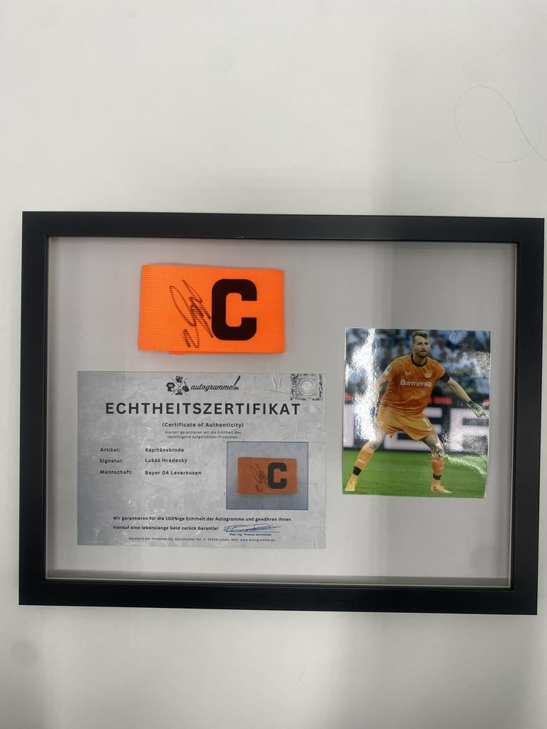 Captain's armband signed by Lukáš Hrádecký in a frame, Bayer 04 Leverkusen autograph