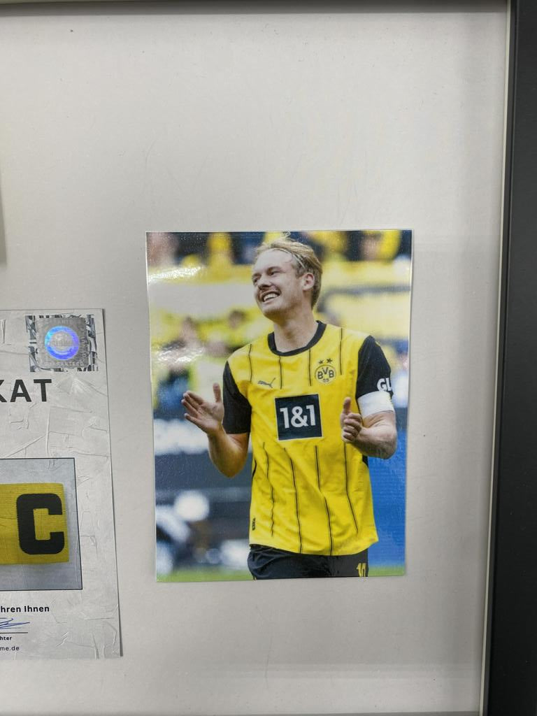 Captain's armband signed by Julian Brandt in a Borussia Dortmund autograph COA frame