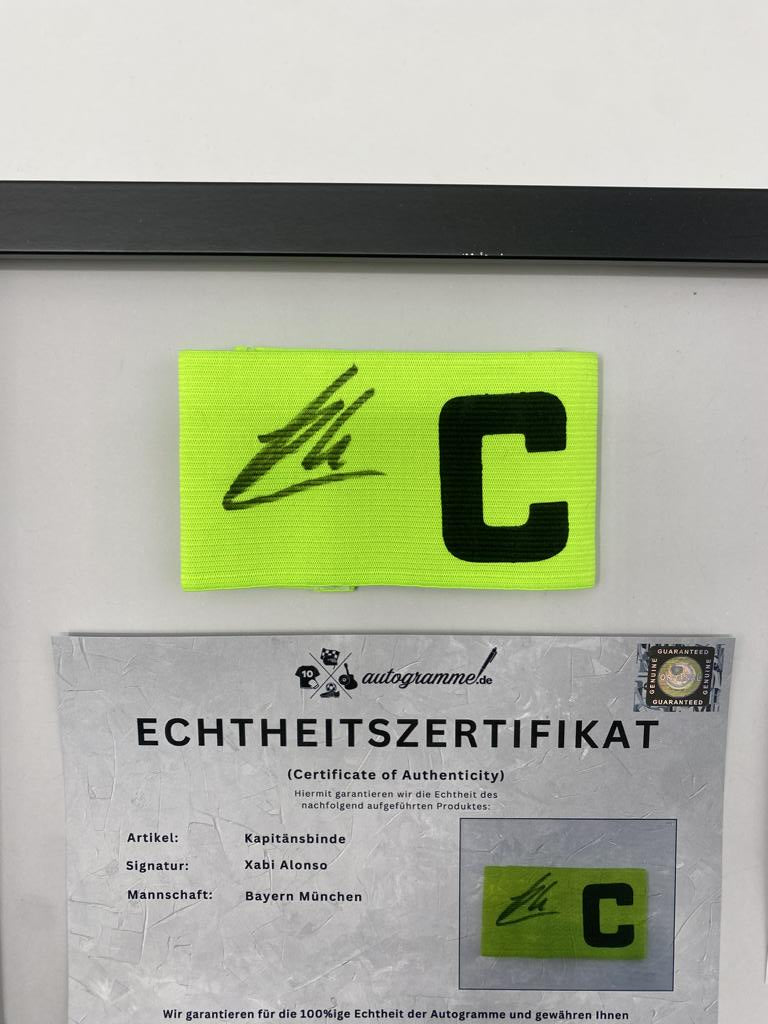 Captain's armband signed by Xabi Alonso in a Bayern Munich autograph COA frame
