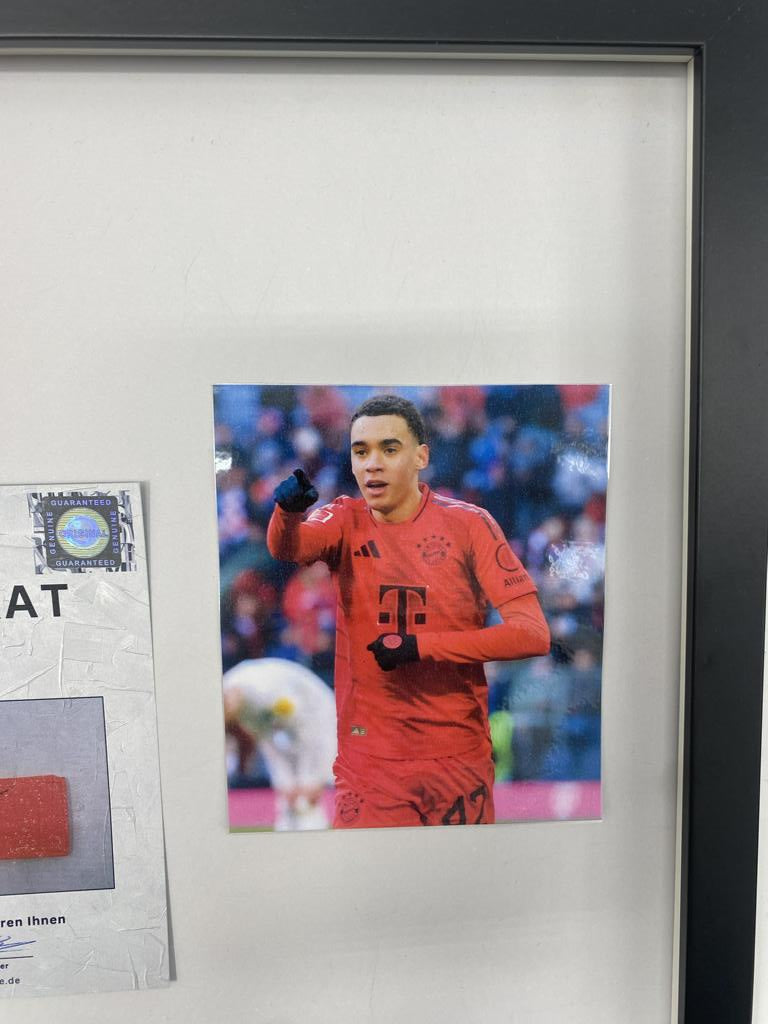 Captain's armband signed by Jamal Musiala in a Bayern Munich football autograph frame