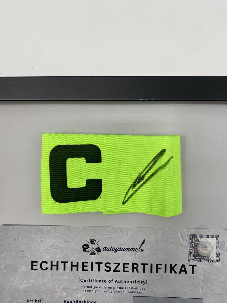 Captain's armband signed by Manuel Neuer as part of a Bayern Munich football autograph