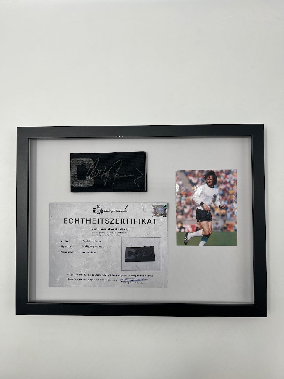 Captain's armband signed by Wolfgang Overath in a frame, Cologne Autograph