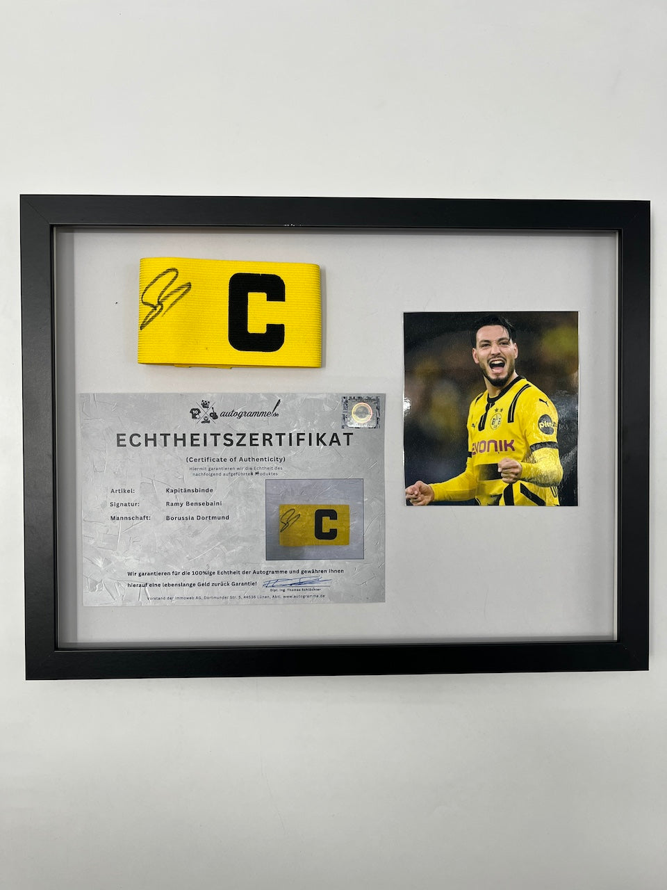 Captain's armband signed by Ramy Bensebaini in a Borussia Dortmund COA frame