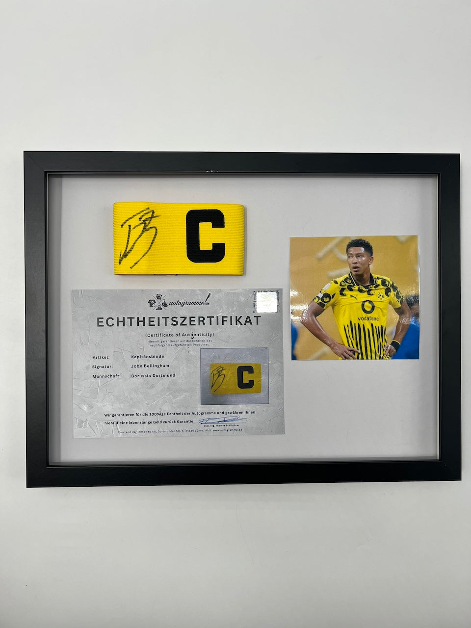 Captain's armband signed by Jobe Bellingham in a Borussia Dortmund COA frame