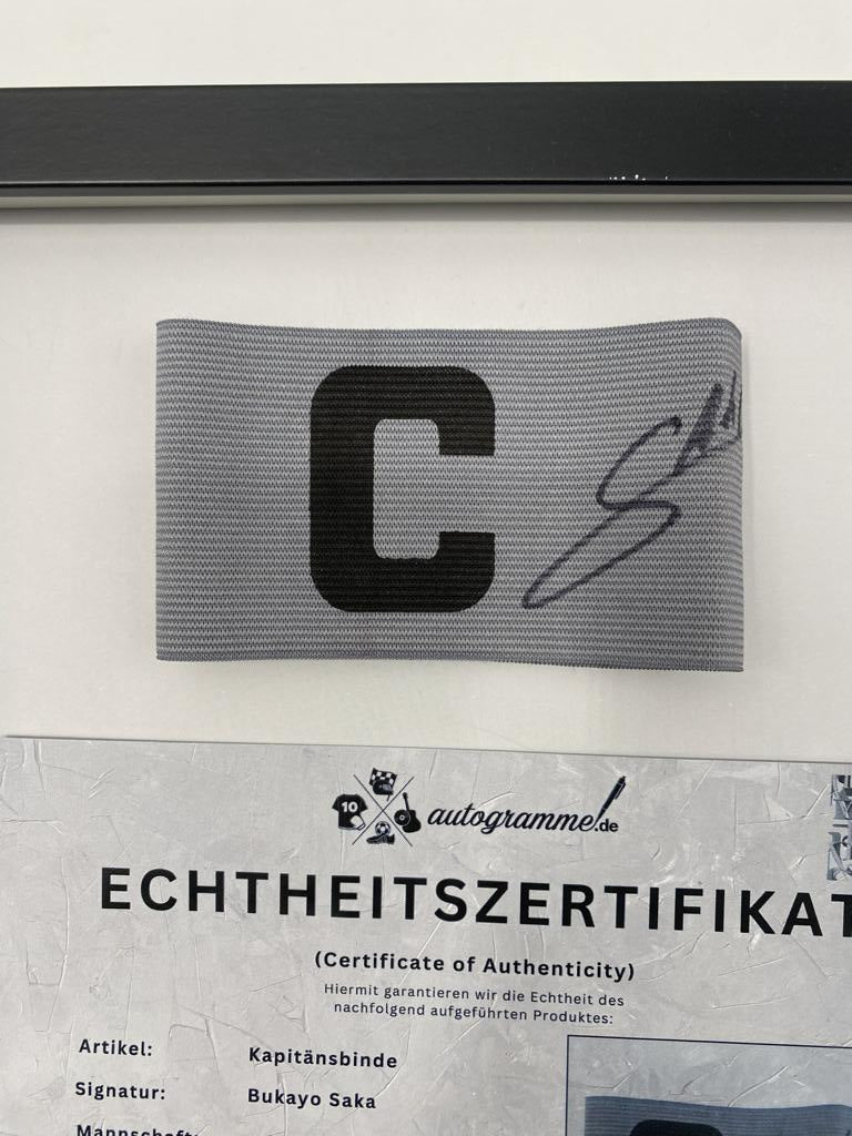 Captain's armband signed by Bukayo Saka in a frame, Arsenal FC autograph