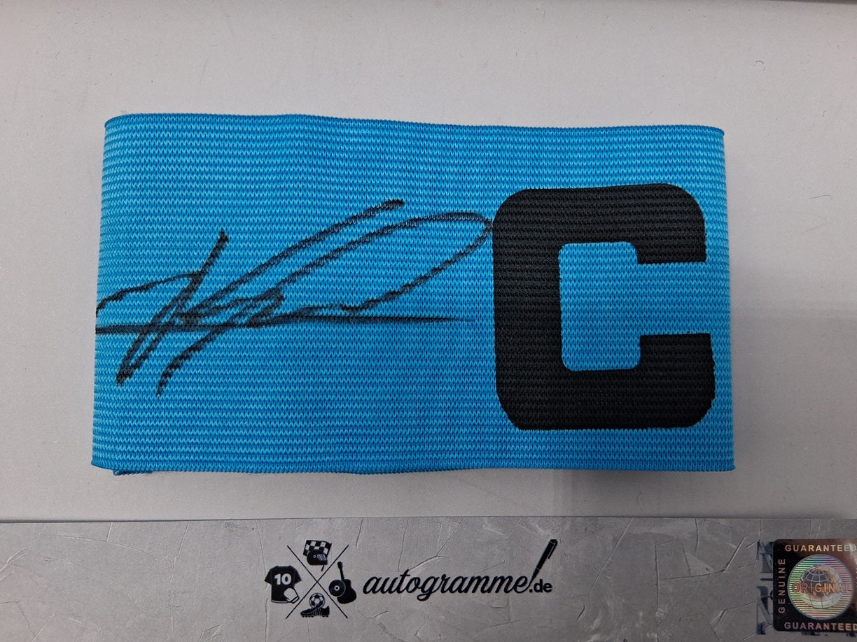 Captain's armband signed by Kylian Mbappe in a Real Madrid COA autograph frame