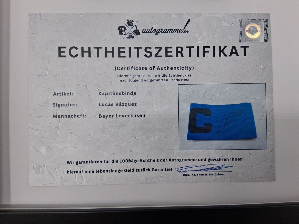 Captain's armband signed by Lucas Vázquez in a Real Madrid COA autograph frame