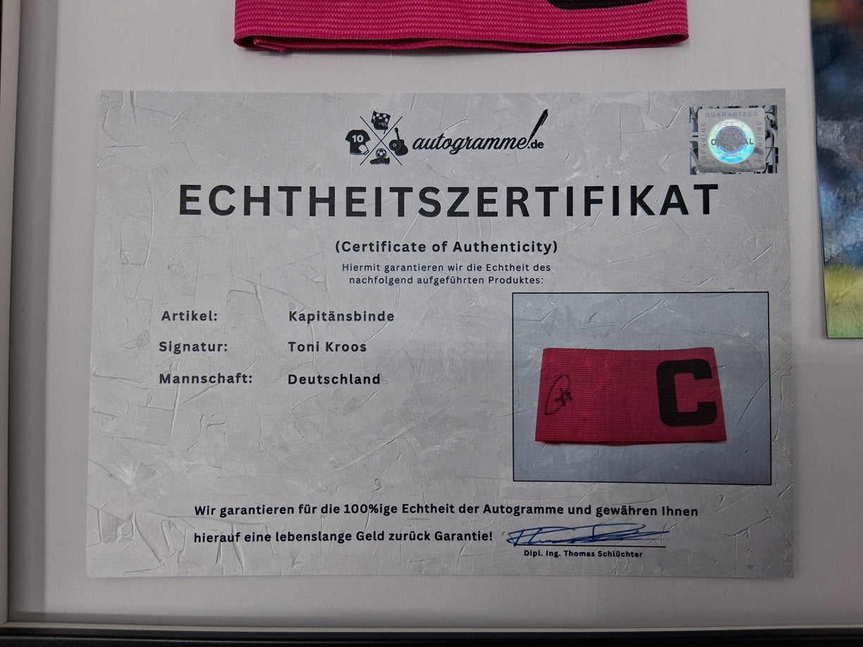 Captain's armband signed by Toni Kroos in the DFB Football COA autograph frame