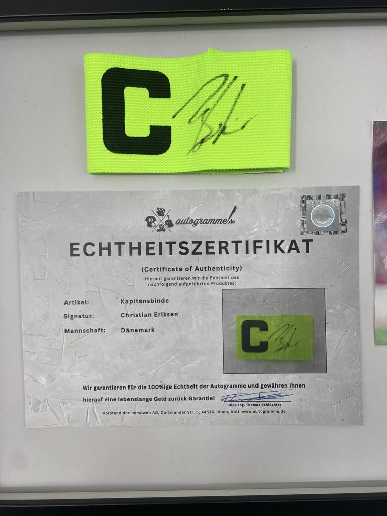 Captain's armband signed by Christian Eriksen in a frame Denmark Autograph