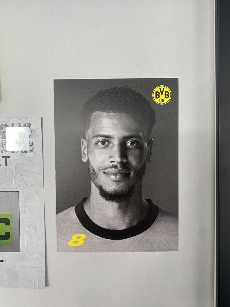 Captain's armband signed by Felix Nmecha as part of the Borussia Dortmund COA