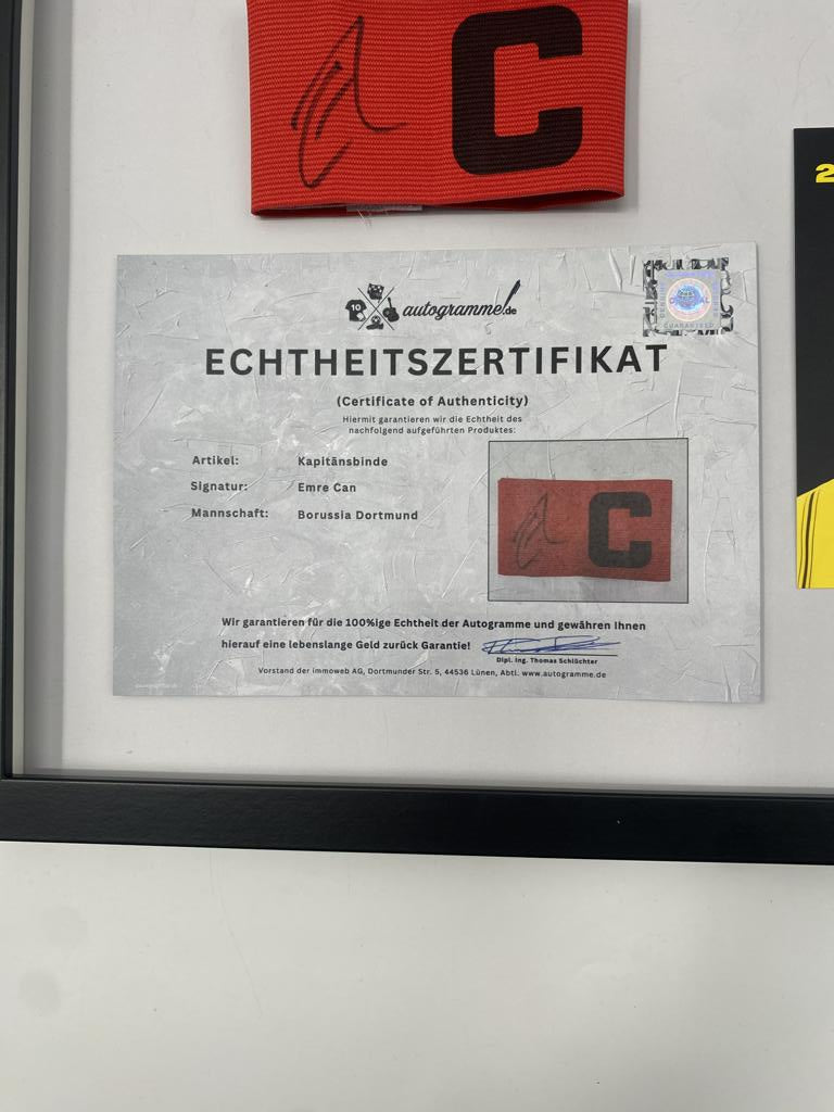 Captain's armband signed by Emre Can in a Borussia Dortmund COA frame