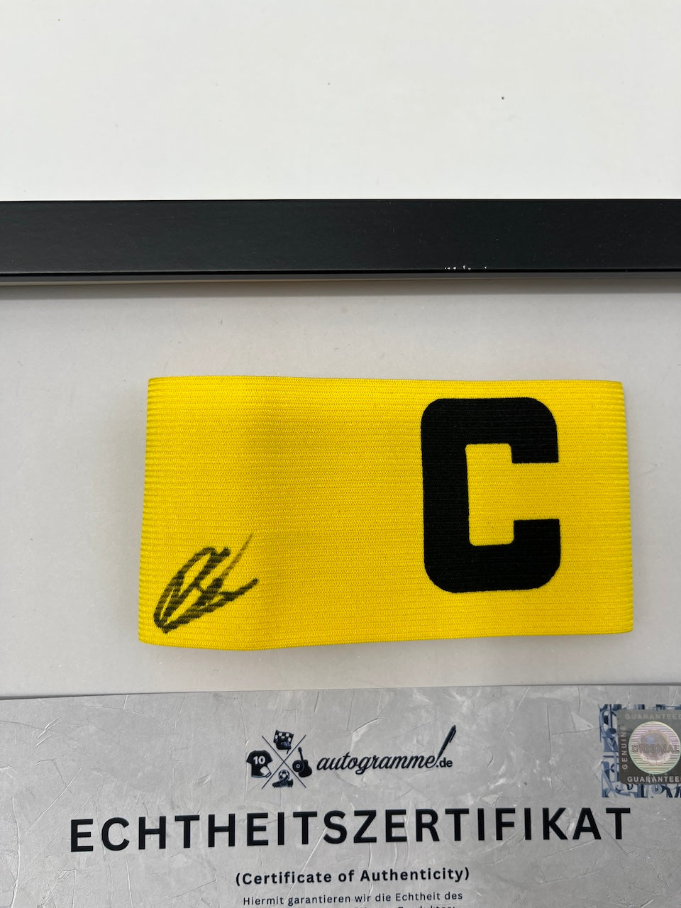 Captain's armband signed by Daniel Svensson as part of the Borussia Dortmund COA