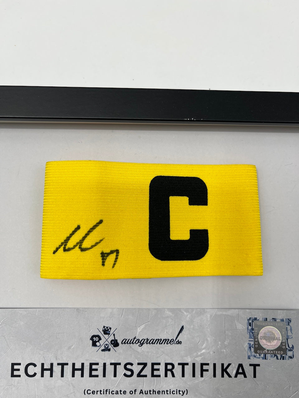 Captain's armband signed by Carney Chukwuemeka in a Borussia Dortmund COA frame