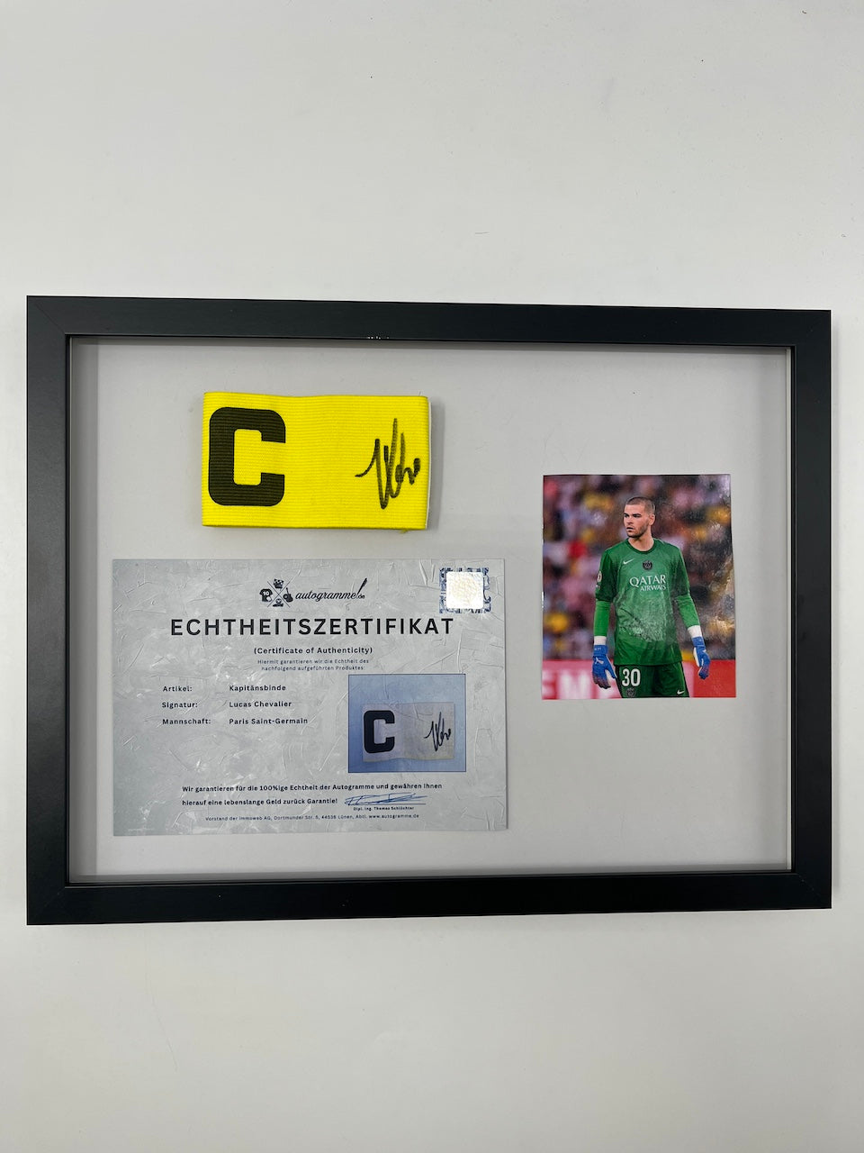 Captain's armband signed by Lucas Chevalier in a PSG COA frame