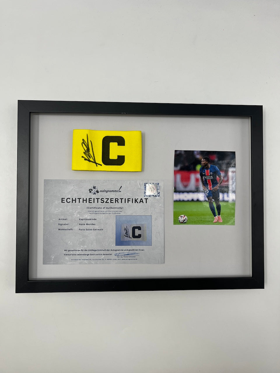 Captain's armband signed by Nuno Mendes in the PSG COA frame