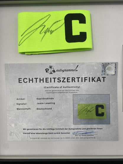 Captain's armband signed by Jamie Leweling in a Germany-themed autograph frame
