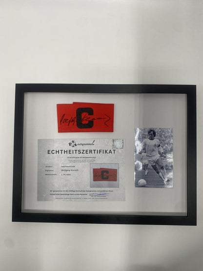Kapitänsbinde Wolfgang Overath signiert im Rahmen 1. FC Köln Autogramm COA
