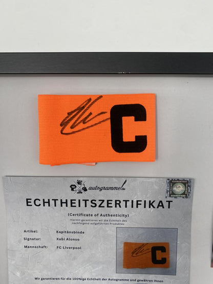 Captain's armband signed by Xabi Alonso in a framed FC Liverpool autograph COA