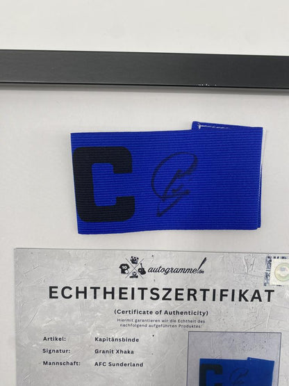 Captain's armband signed by Granit Xhaka in a frame, AFC Sunderland autograph