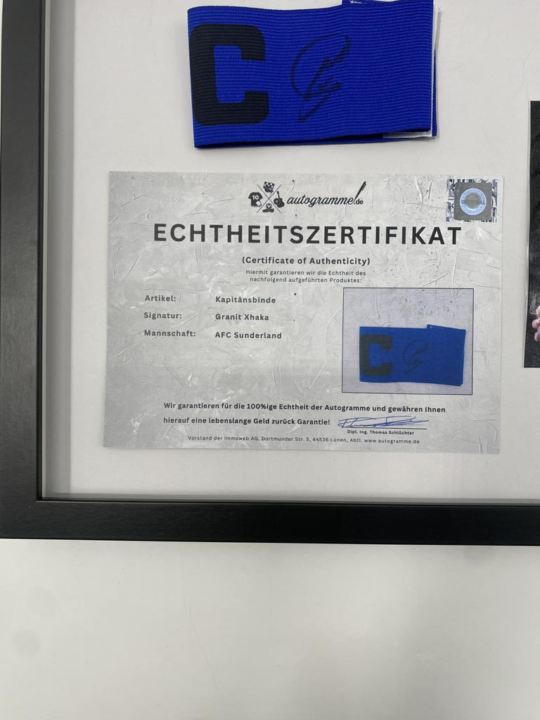 Captain's armband signed by Granit Xhaka in a frame, AFC Sunderland autograph