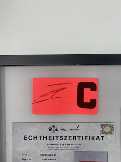 Captain's armband signed by Jamal Musiala in a Bayern Munich football autograph frame