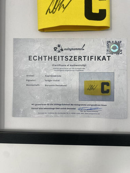 Captain's armband signed by Gregor Kobel as part of the Borussia Dortmund COA football campaign