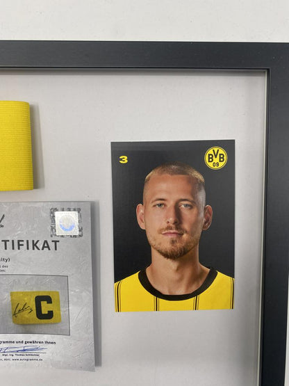 Brazalete de capitán firmado por Waldemar Anton en un nuevo certificado de autenticidad (COA) del Borussia Dortmund.
