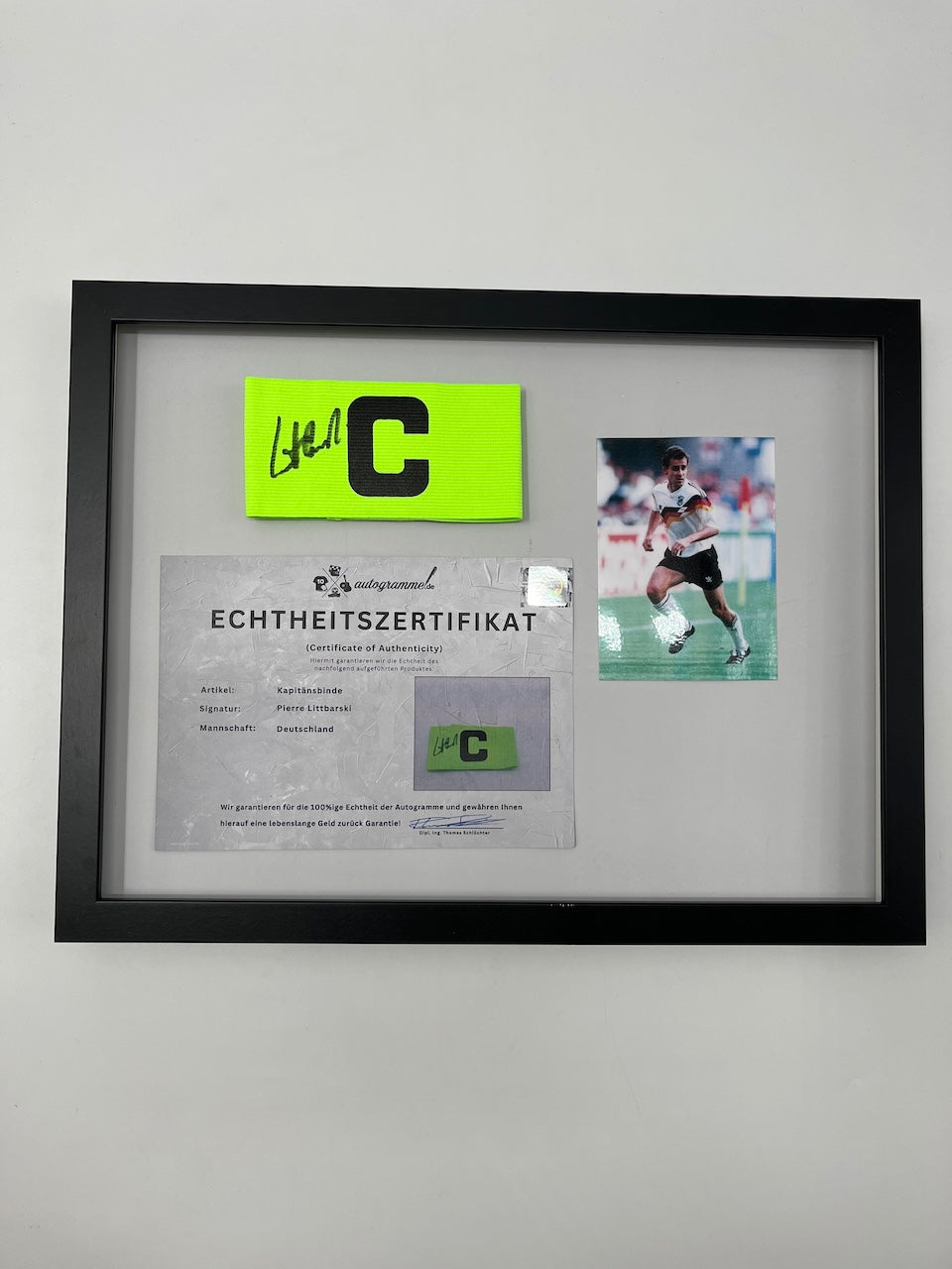 Captain's armband signed by Pierre Littbarski in a DFB autograph COA frame