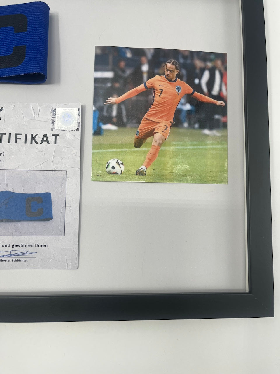Captain's armband signed by Xavi Simons in a frame, Netherlands Autograph