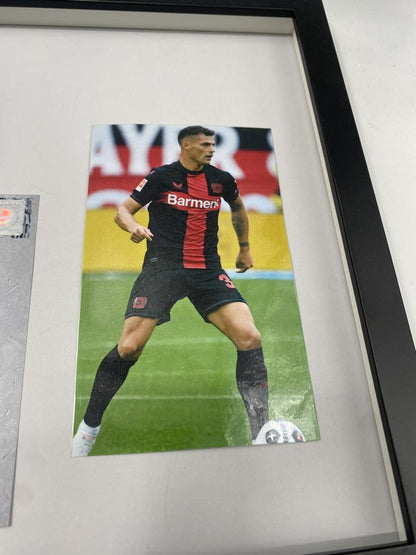 Captain's armband signed by Granit Xhaka in a frame, Bayer Leverkusen autograph