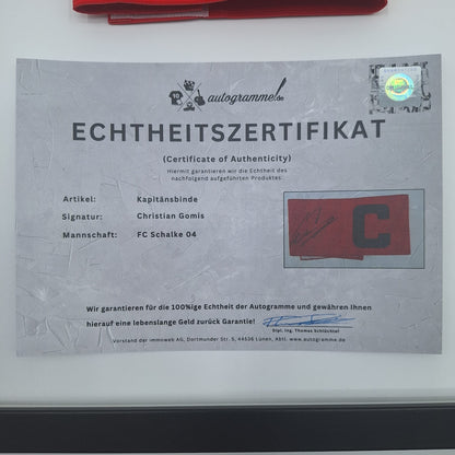 Kapitänsbinde Christian Gomis signiert im Rahmen Schalke 04 COA Rot