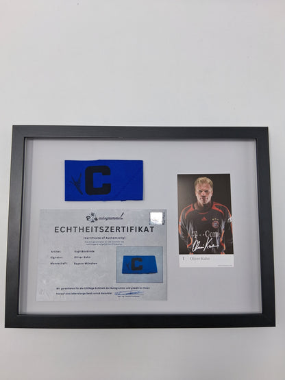 Captain's armband signed by Oliver Kahn in a Bayern Munich football autograph frame
