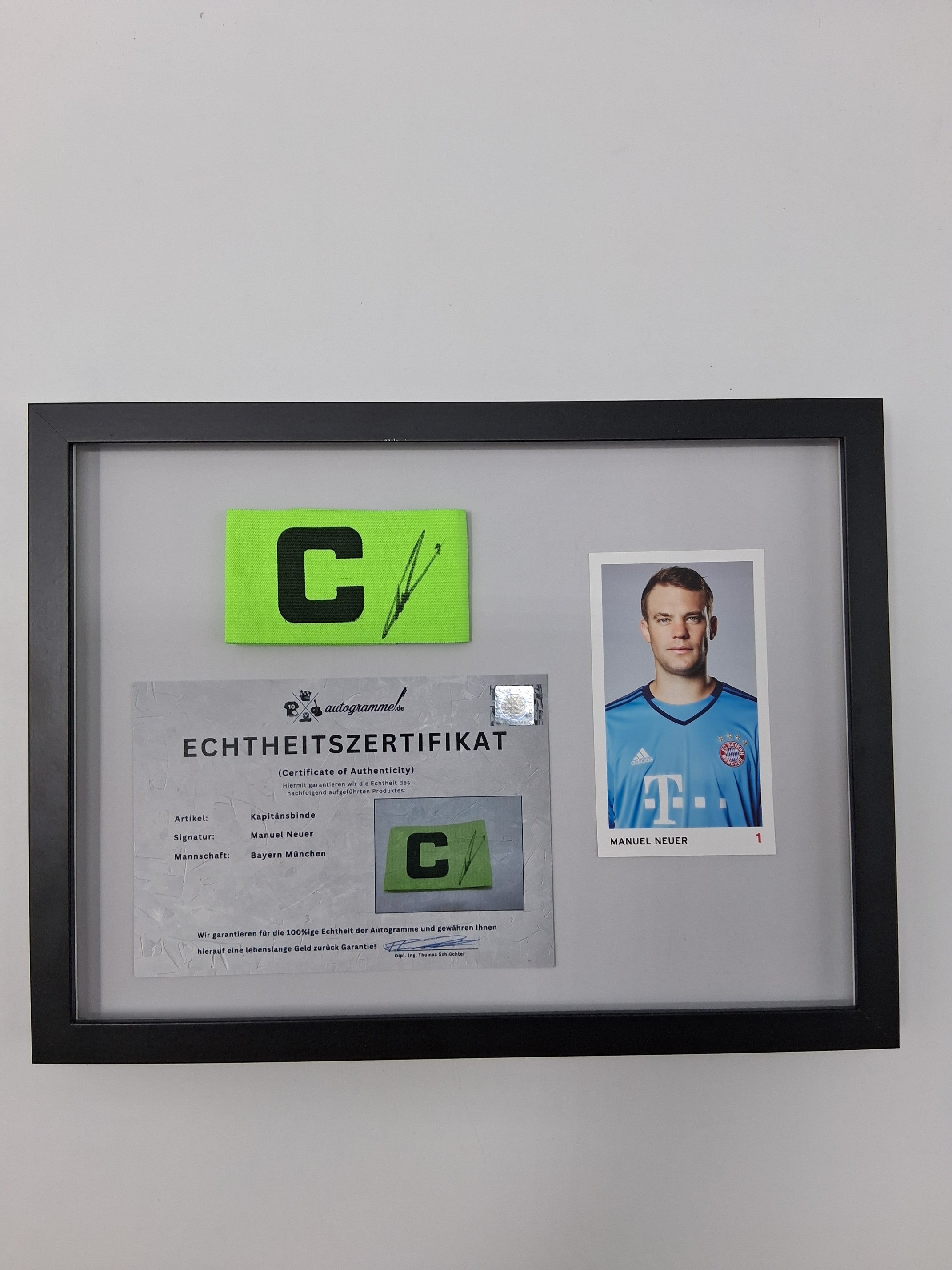 Captain's armband signed by Manuel Neuer as part of a Bayern Munich football autograph