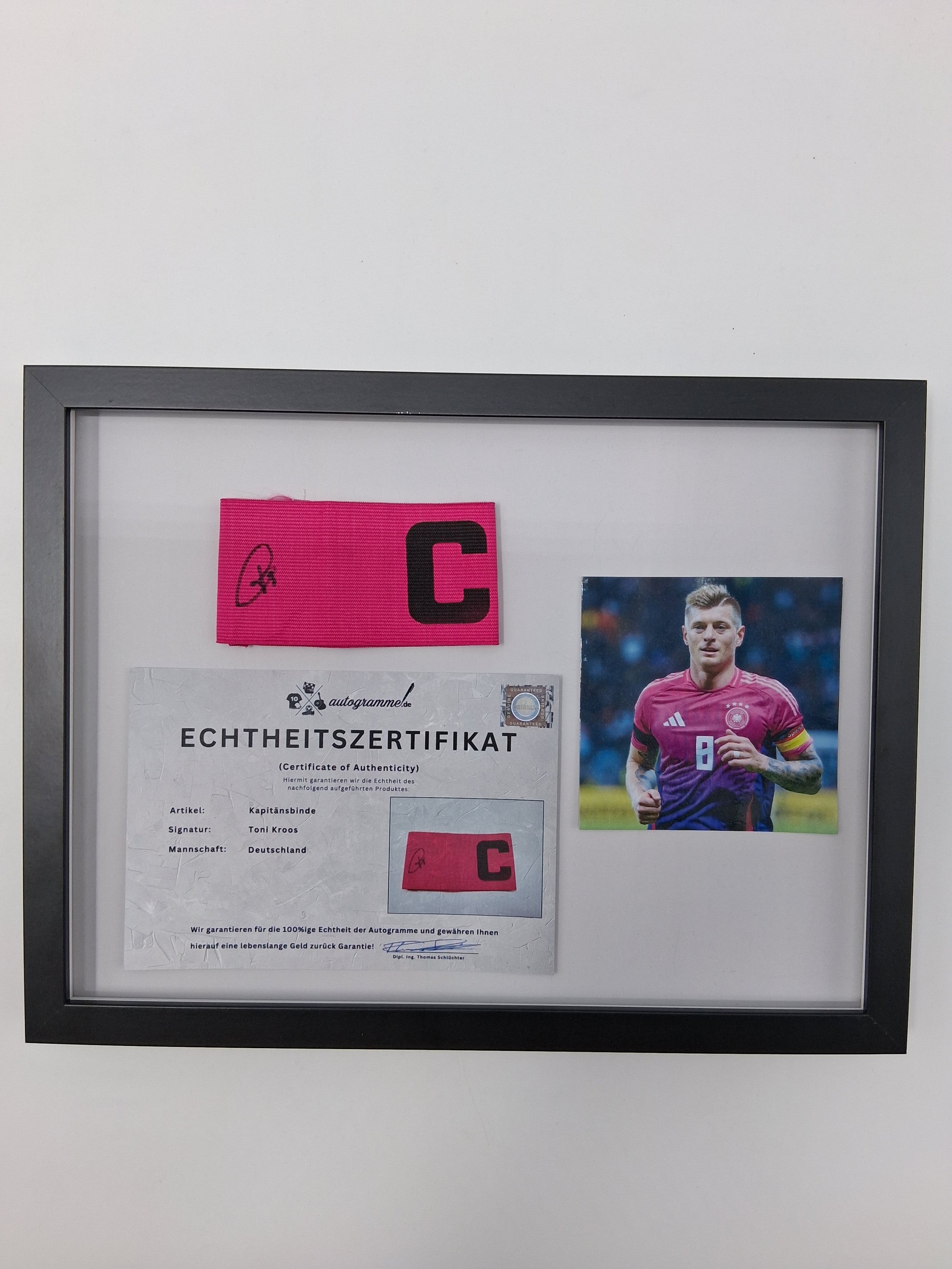 Captain's armband signed by Toni Kroos in the DFB Football COA autograph frame