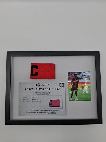 Captain's armband signed by Nathan Tella in a Bayer Leverkusen autograph frame