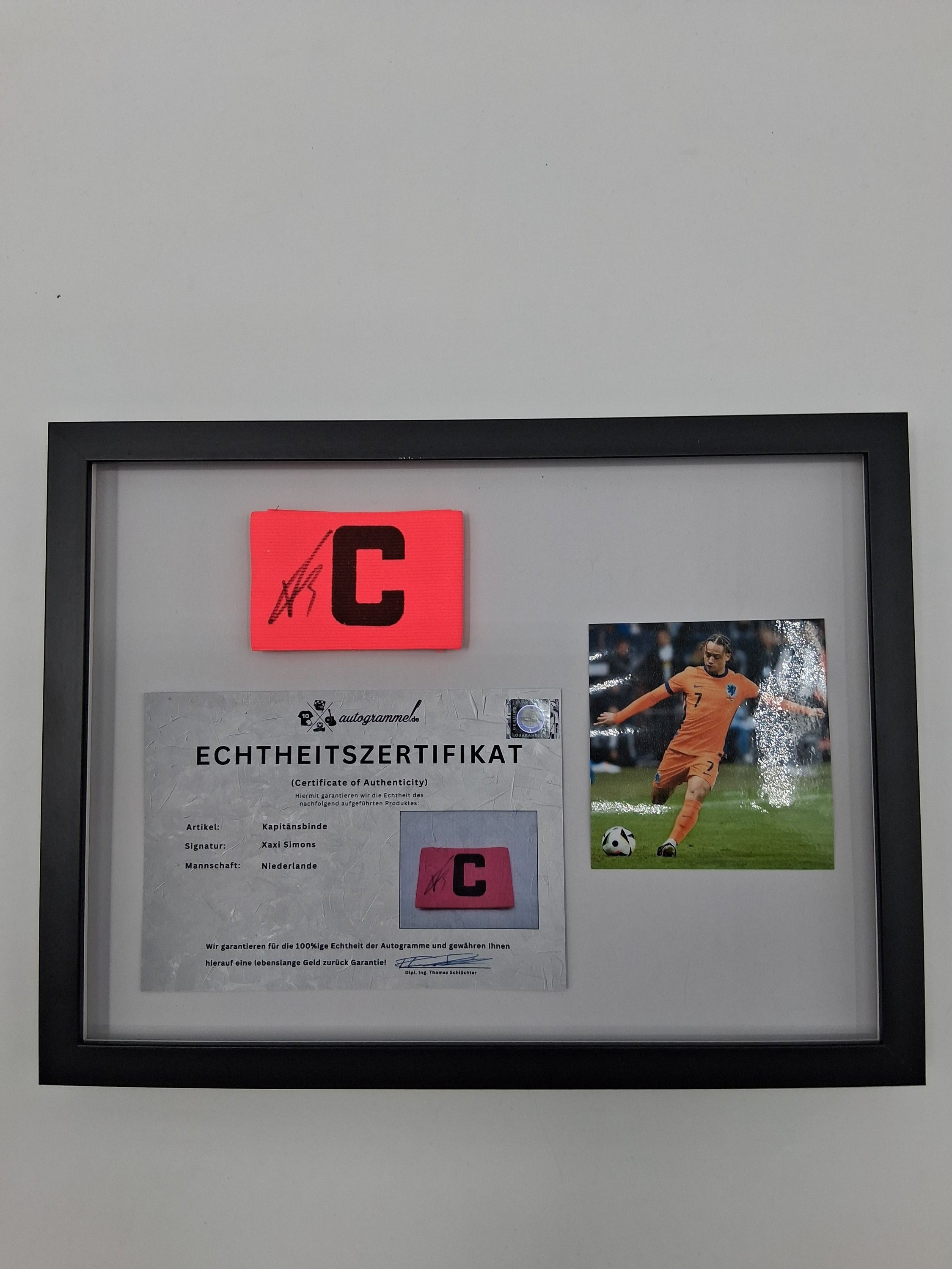 Captain's armband signed by Xavi Simons in a frame, Netherlands Autograph