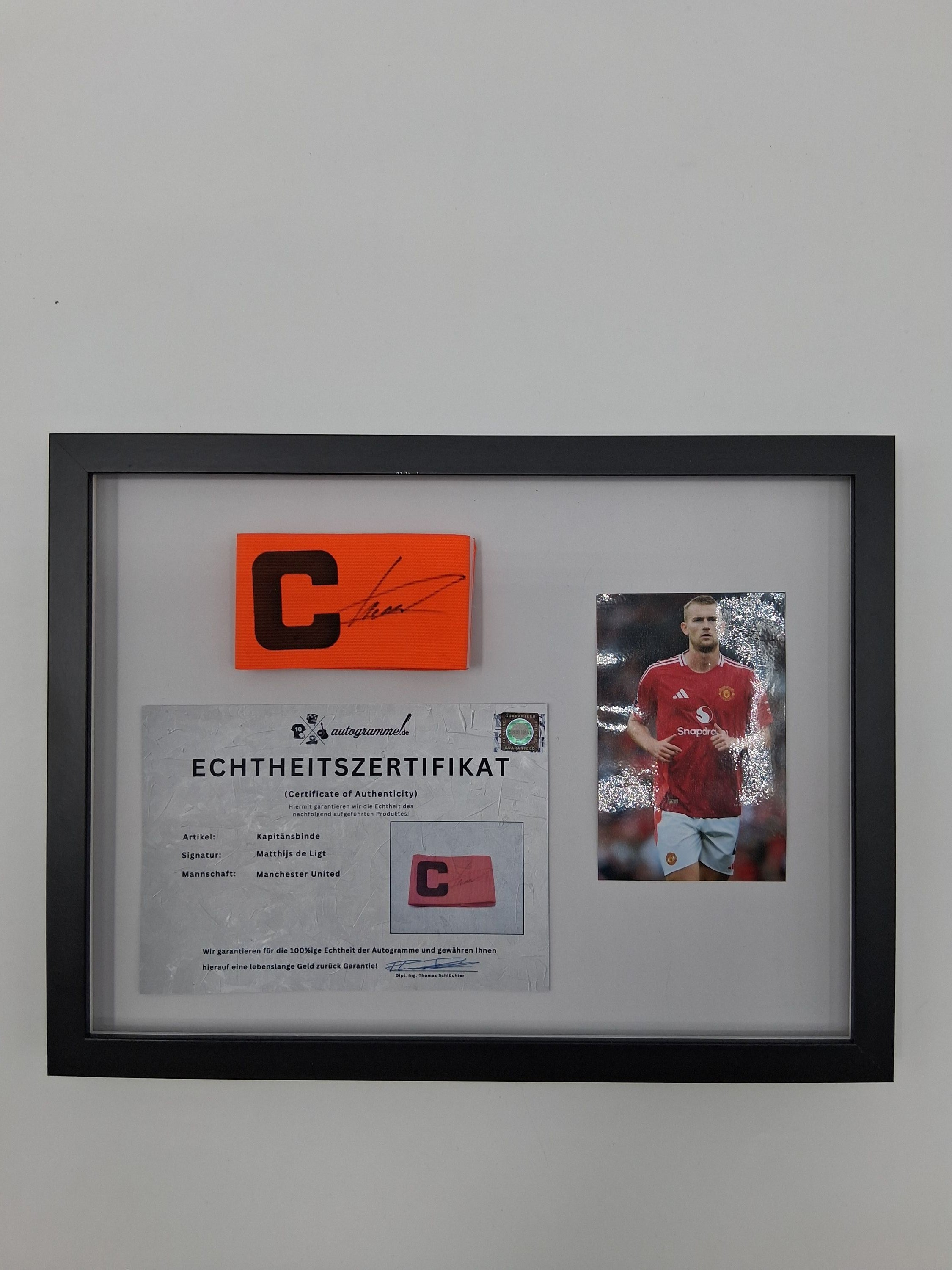 Captain's armband signed by Matthijs de Ligt as part of the Manchester United COA