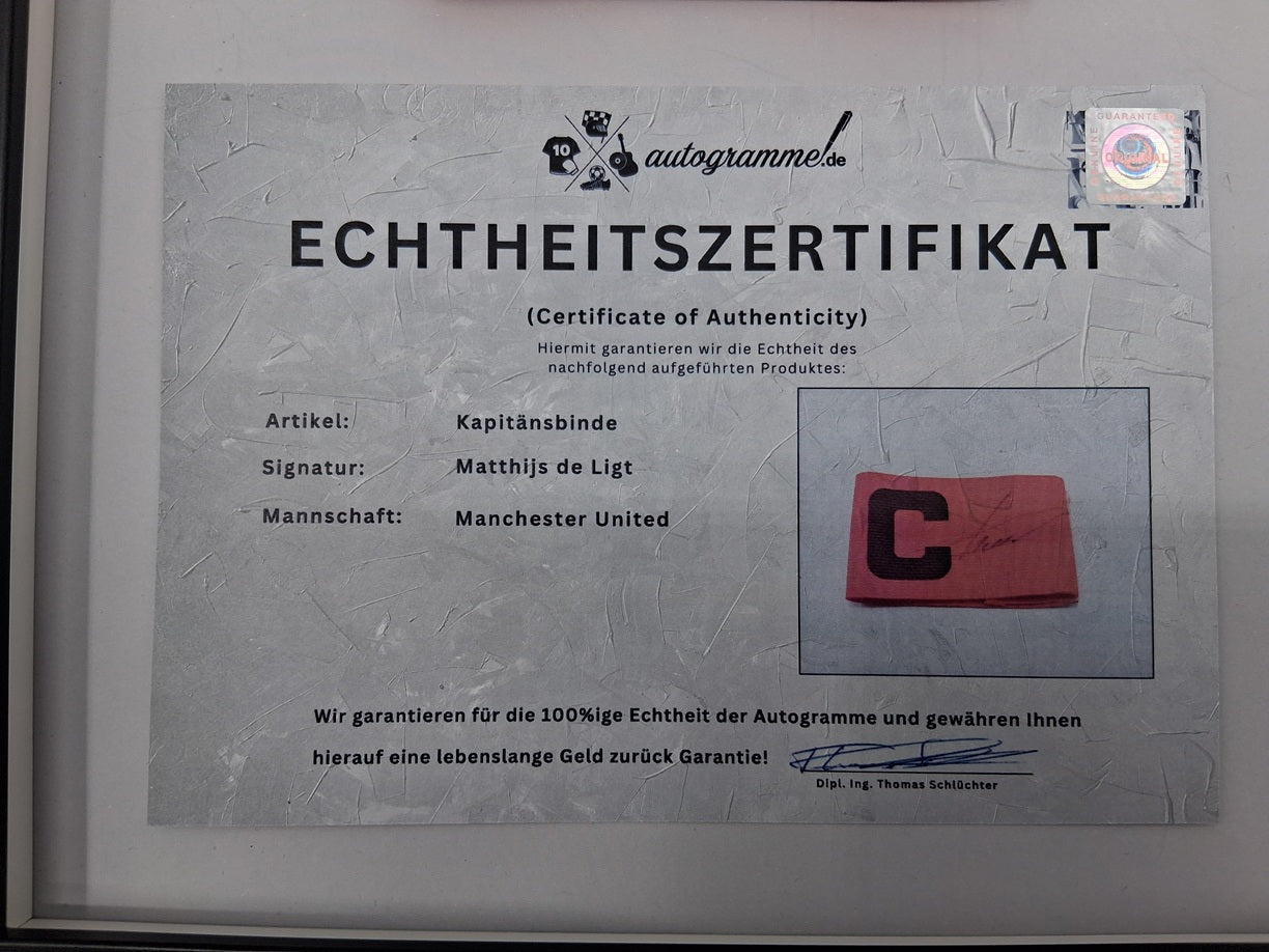 Captain's armband signed by Matthijs de Ligt as part of the Manchester United COA
