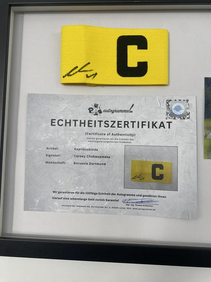 Captain's armband signed by Carney Chukwuemeka in a Borussia Dortmund autograph frame