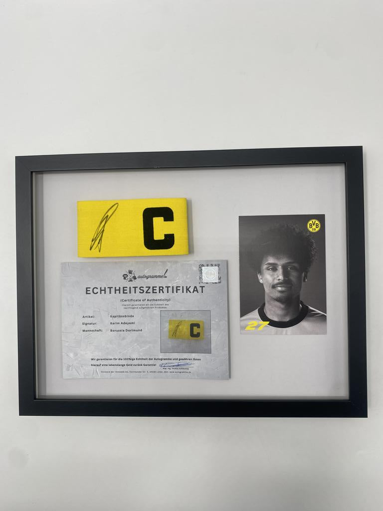 Captain's armband signed by Karim Adeyemi in a Borussia Dortmund autograph COA frame