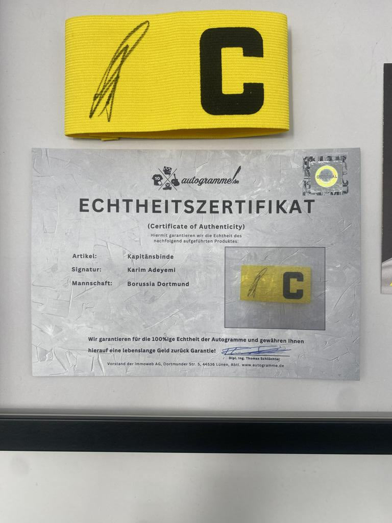 Captain's armband signed by Karim Adeyemi in a Borussia Dortmund autograph COA frame