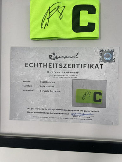 Captain's armband signed by Felix Nmecha as part of the Borussia Dortmund COA